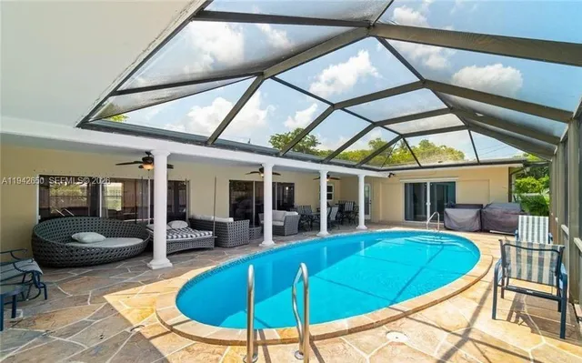 a view of a dining room with furniture wooden floor and a chandelier