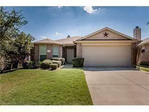 a view of a house with yard and sitting area