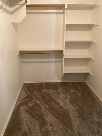 a open kitchen with stainless steel appliances granite countertop a refrigerator and a stove top oven