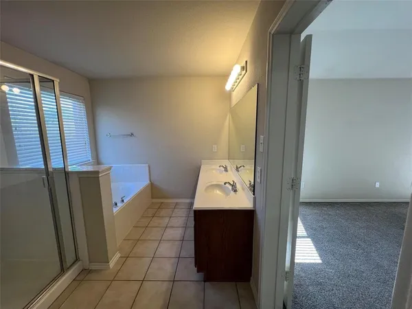 a living room with furniture and a ceiling fan