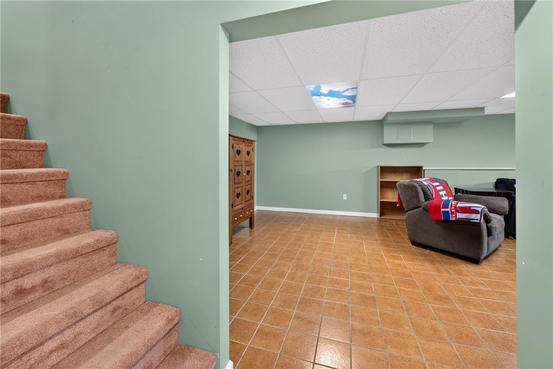 1307 Klinerd Road Pennsburg, PA 18073 - Photo 22 of 53 A spacious lower level features tile flooring and access to a carpeted staircase.