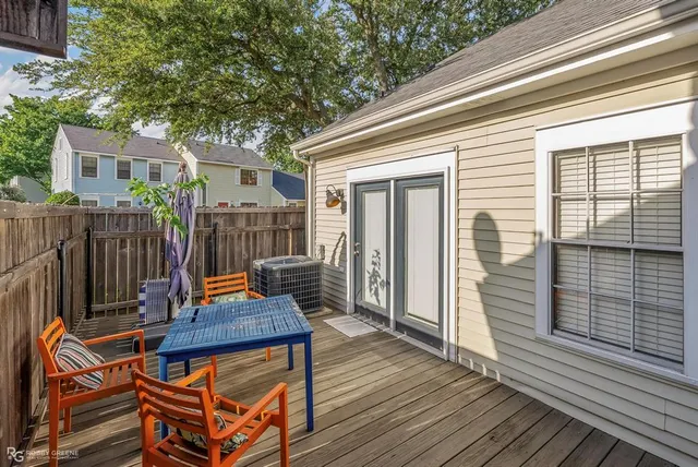 a view of a wooden chairs on the deck