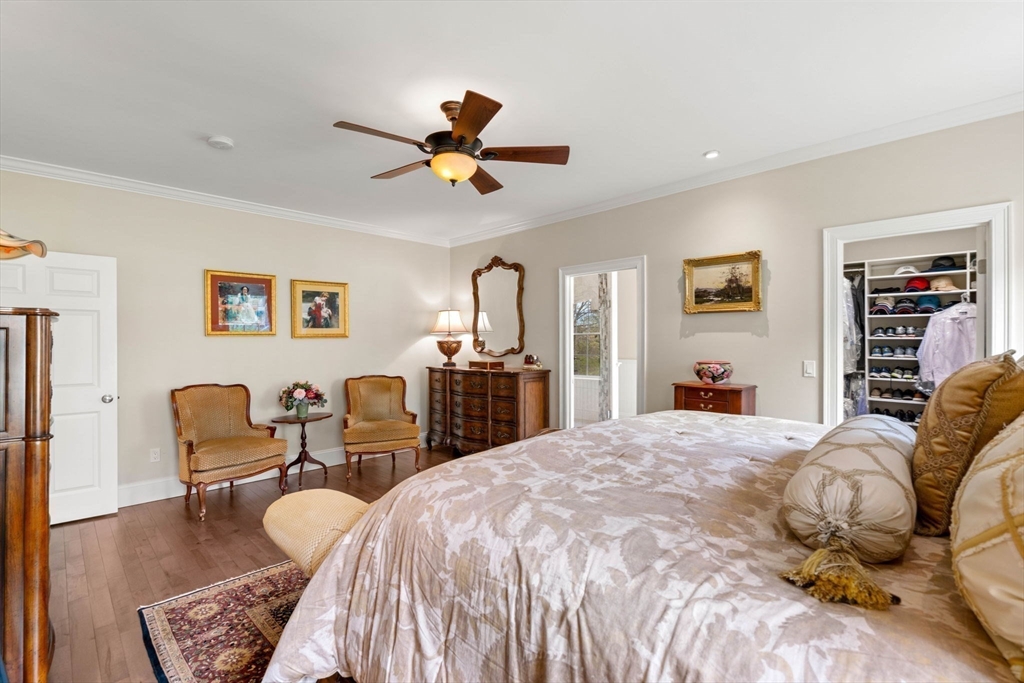 4 Point Shore Overlook Amesbury, MA 01913 - Photo 18 of 42 a bedroom with a bed and wooden floor