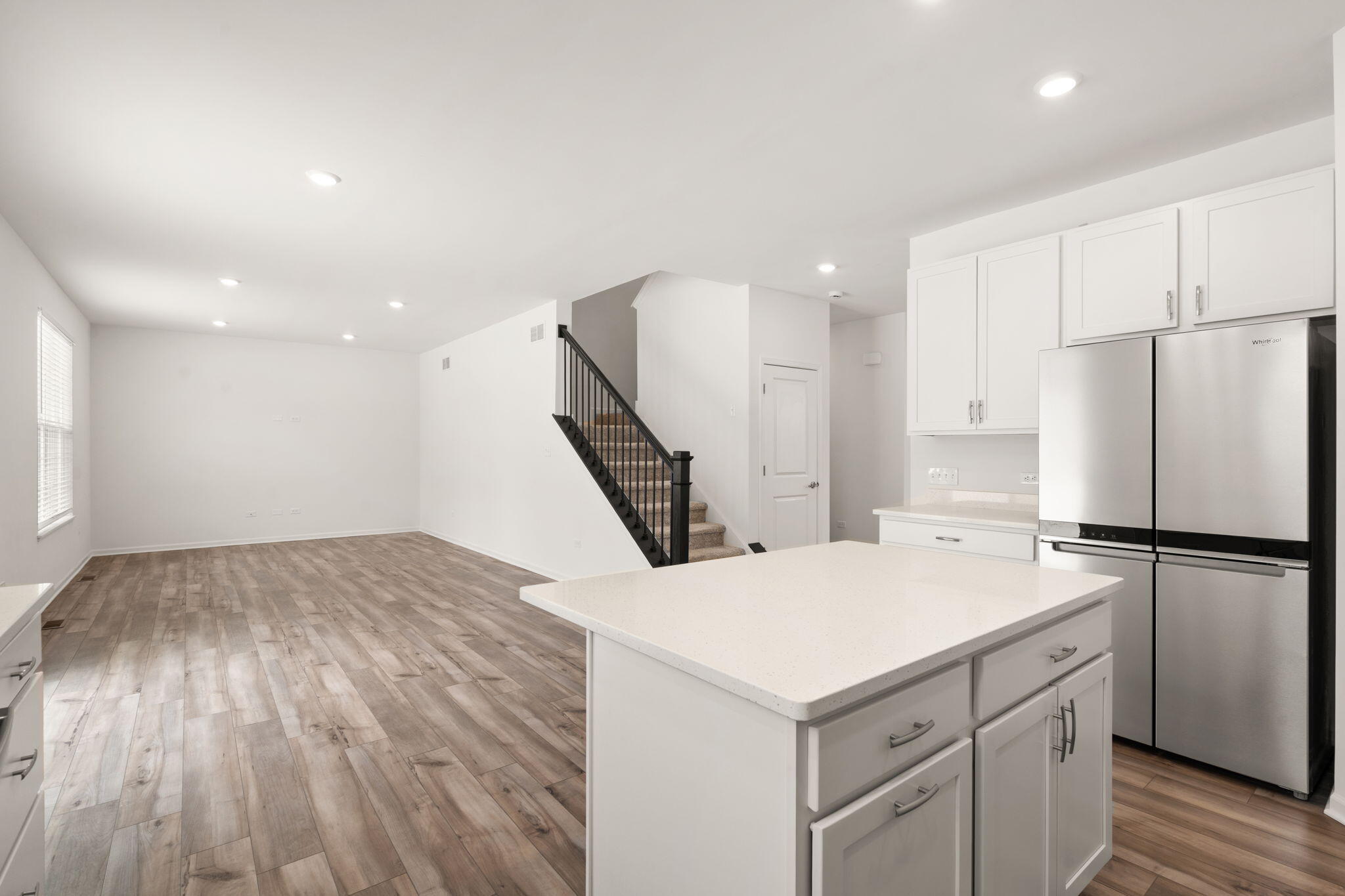 1811 East 111th Place Crown Point, IN 46307 - Photo 14 of 35 a kitchen with a refrigerator and a stove top oven