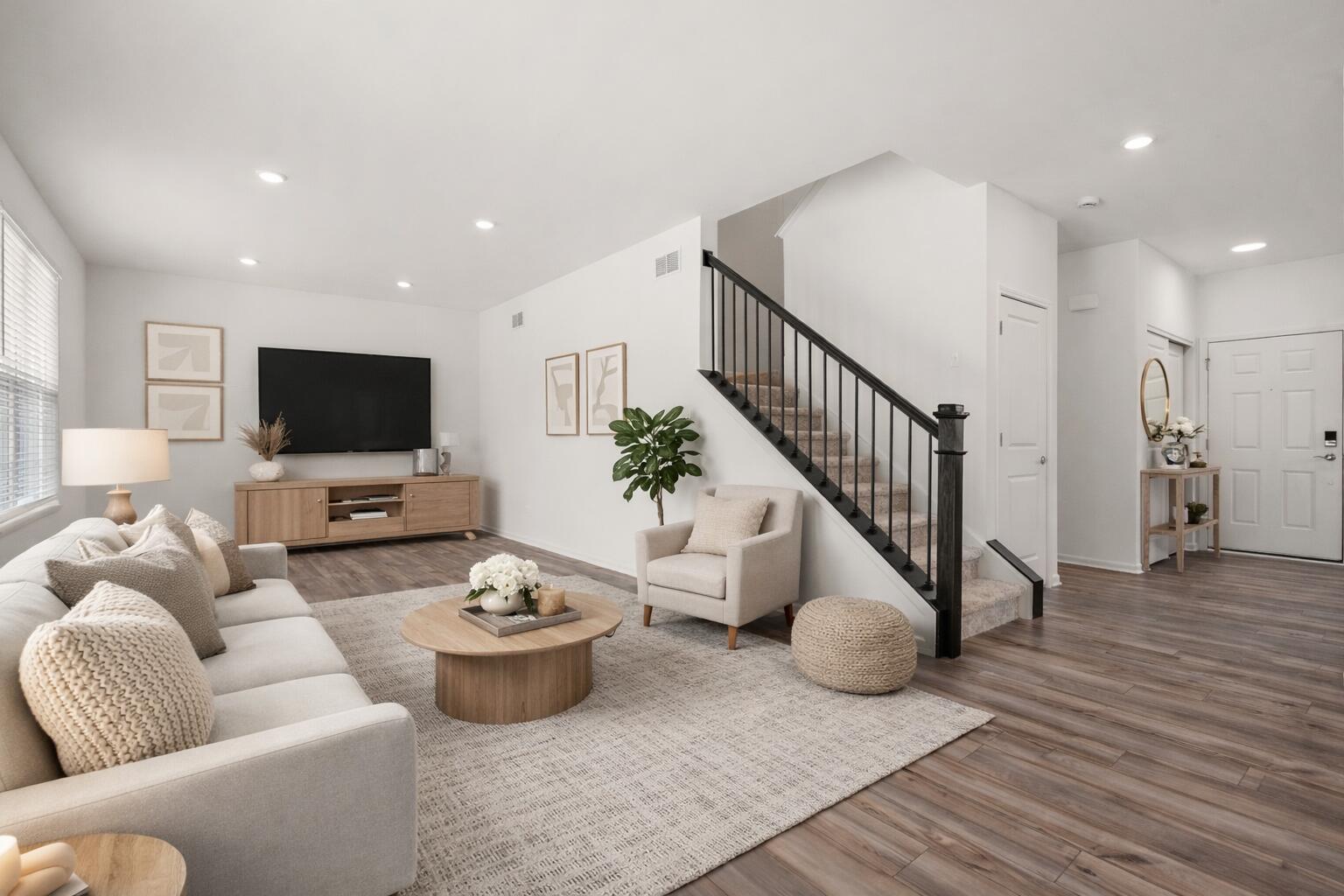 1811 East 111th Place Crown Point, IN 46307 - Photo 2 of 35 a living room with furniture and a flat screen tv