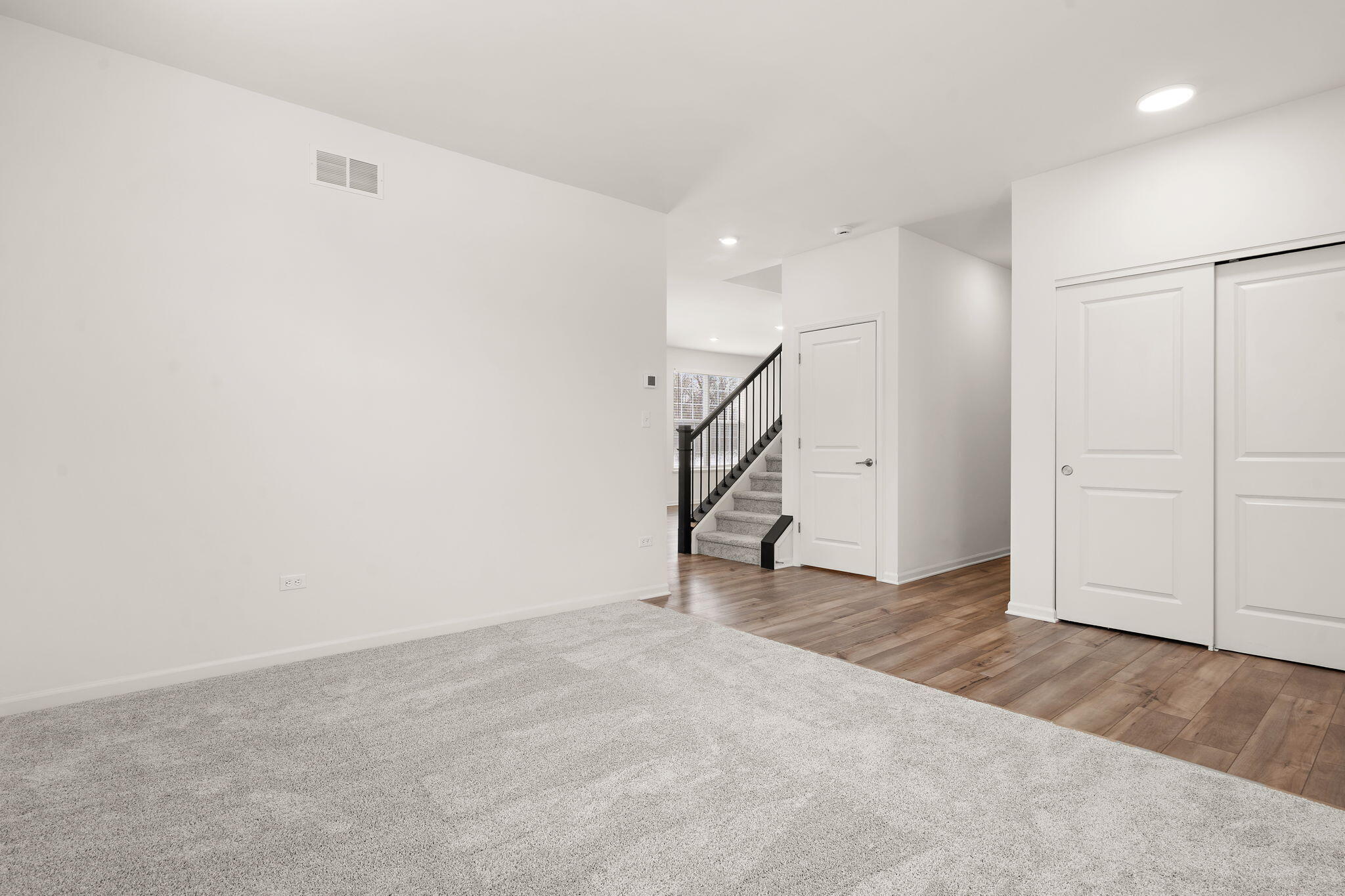 1811 East 111th Place Crown Point, IN 46307 - Photo 6 of 35 an empty room with staircase and white walls