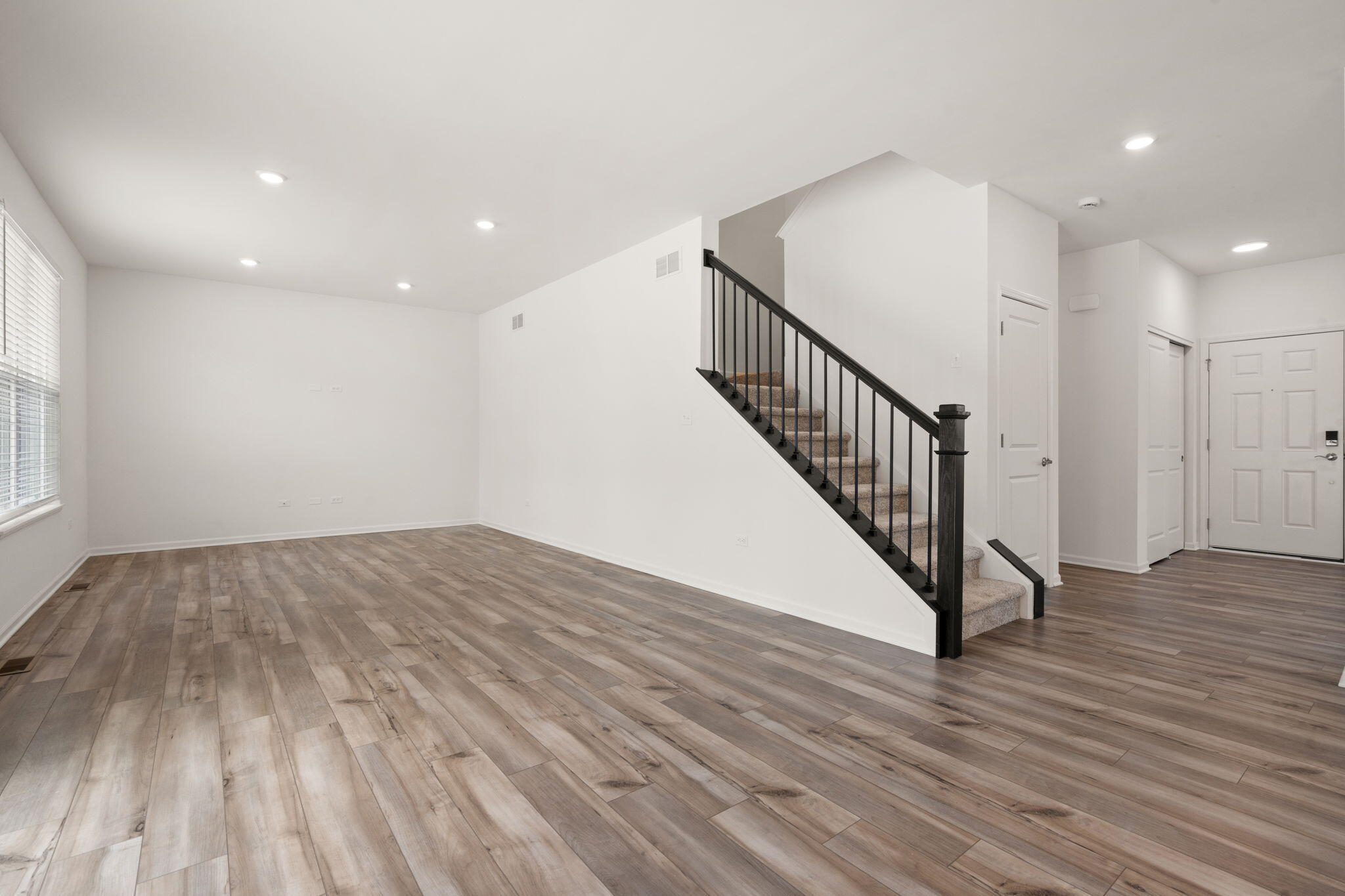 1811 East 111th Place Crown Point, IN 46307 - Photo 8 of 35 a view of a hallway with wooden floor