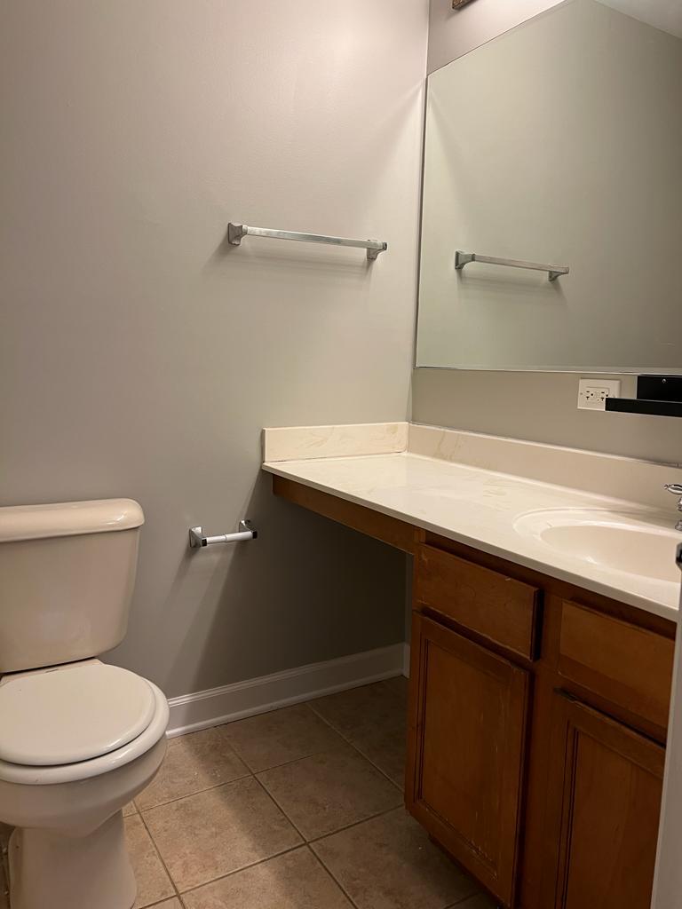 364 Risen Star Lane, Unit 364 Oswego, IL 60543 - Photo 13 of 15 a bathroom with a sink a toilet and a mirror