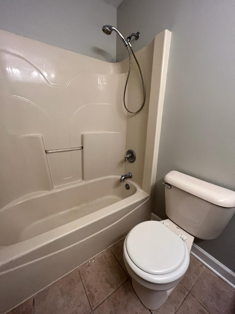 364 Risen Star Lane, Unit 364 Oswego, IL 60543 - Photo 14 of 15 a bathroom with a toilet and a bath tub