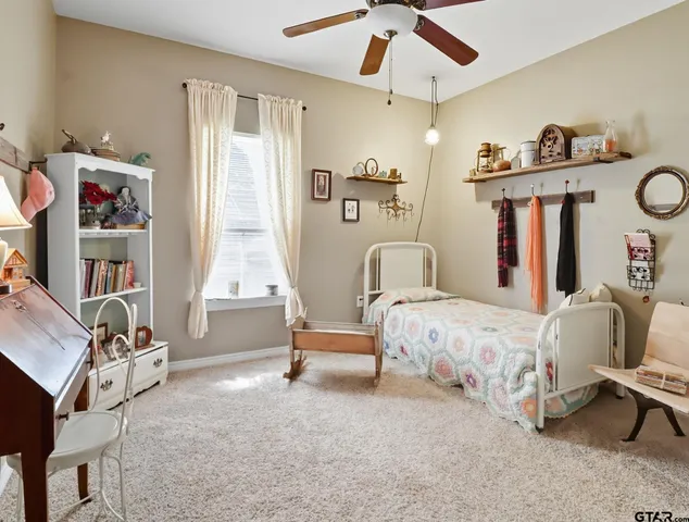 a bedroom with bed and a window