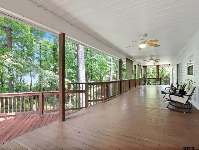 a view of a porch with wooden floor and outdoor space