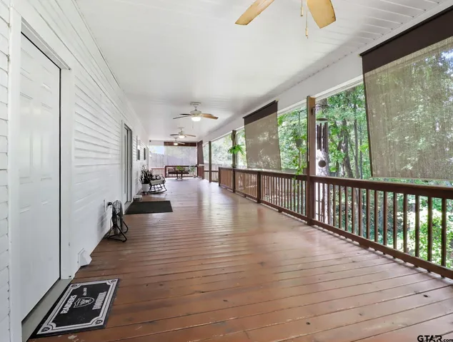 a view of a patio with wooden floor