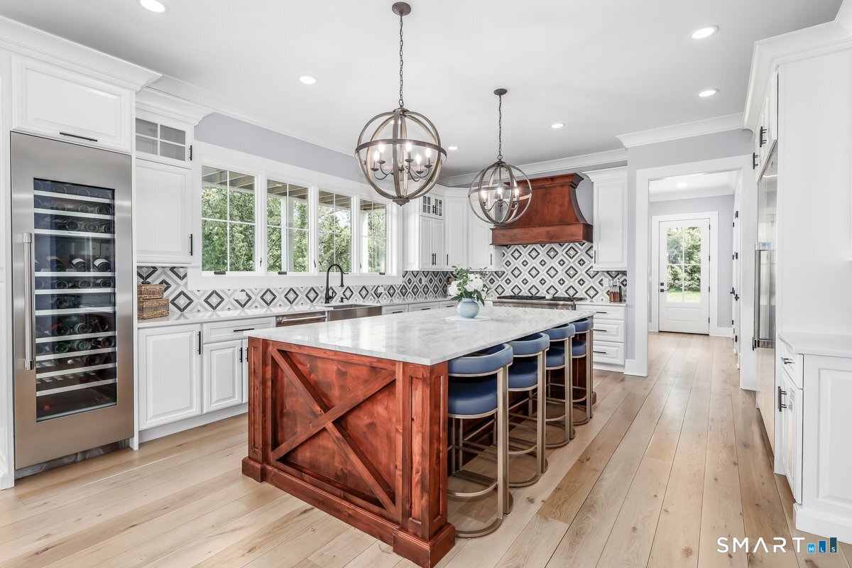 2 Pond View Lane Sherman, CT 06784 - Photo 11 of 40 a kitchen with stainless steel appliances granite countertop a stove a sink and a wooden floors