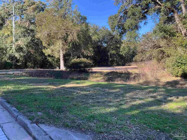 a view of outdoor space with deck and yard