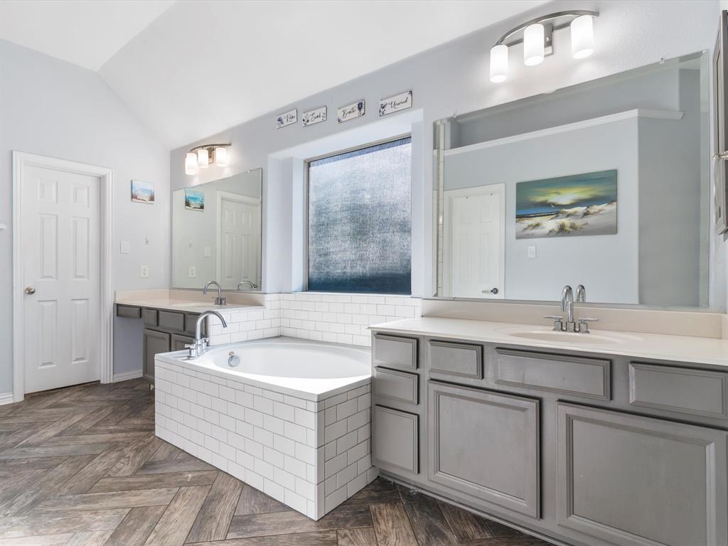 437 Hackworth Street Roanoke, TX 76262 - Photo 18 of 35 a bathroom with a tub a sink and mirror