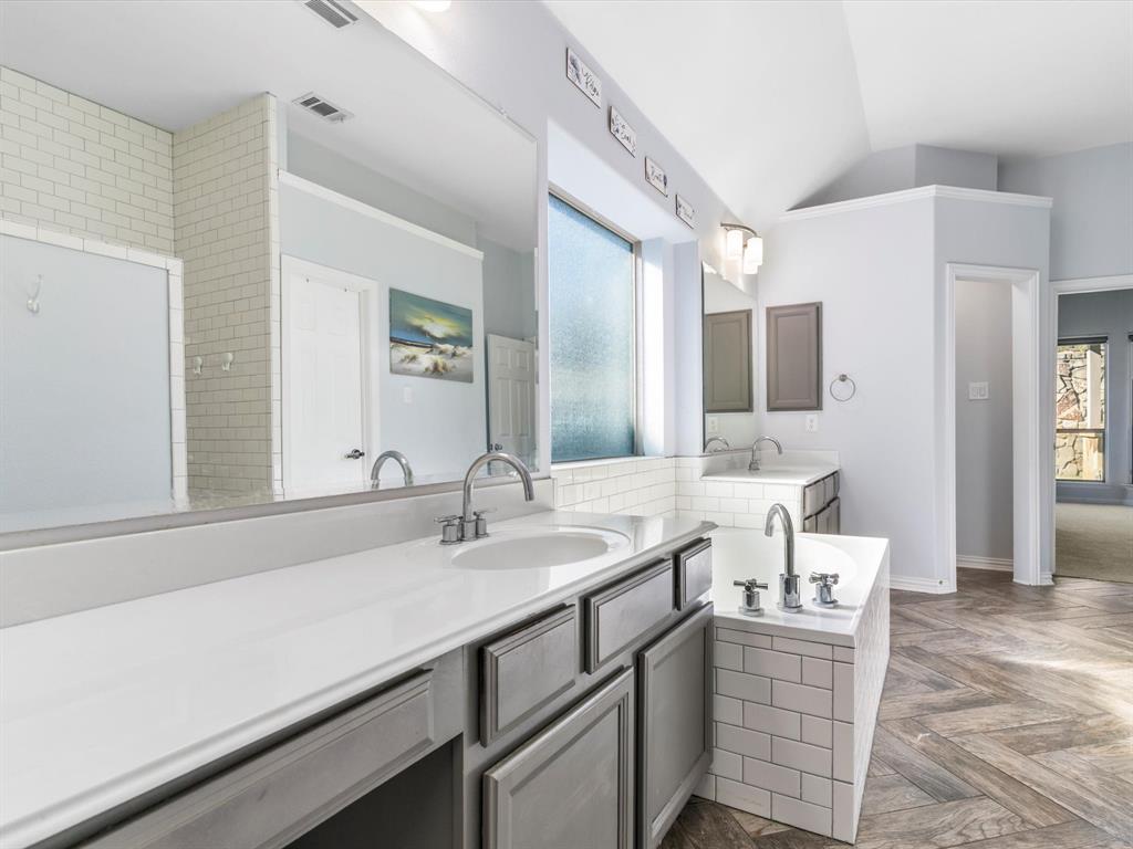 437 Hackworth Street Roanoke, TX 76262 - Photo 19 of 35 a bathroom with a sink and a mirror