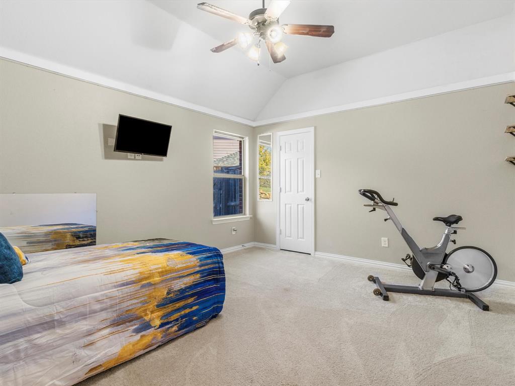 437 Hackworth Street Roanoke, TX 76262 - Photo 22 of 35 a bedroom with a bed and a ceiling fan