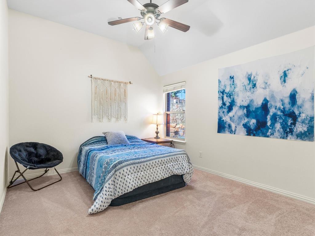 437 Hackworth Street Roanoke, TX 76262 - Photo 25 of 35 a bedroom with a bed and a painting on the wall