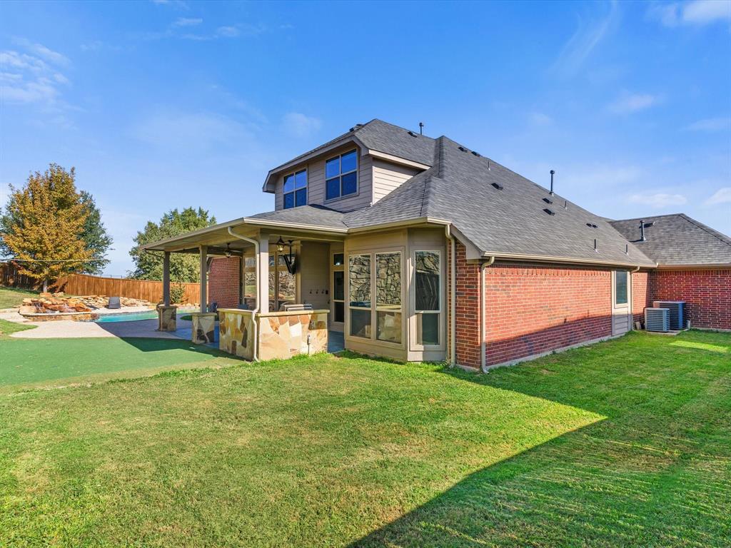 437 Hackworth Street Roanoke, TX 76262 - Photo 33 of 35 a view of a house with a yard and sitting area