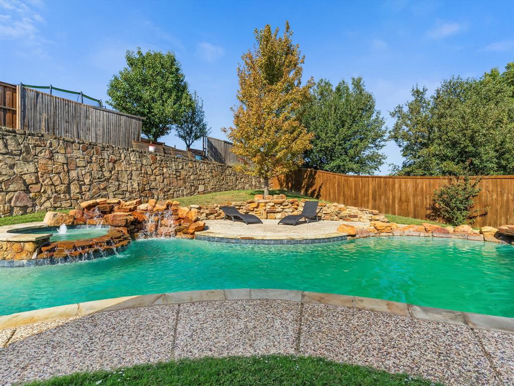 437 Hackworth Street Roanoke, TX 76262 - Photo 34 of 35 a view of a backyard with a garden