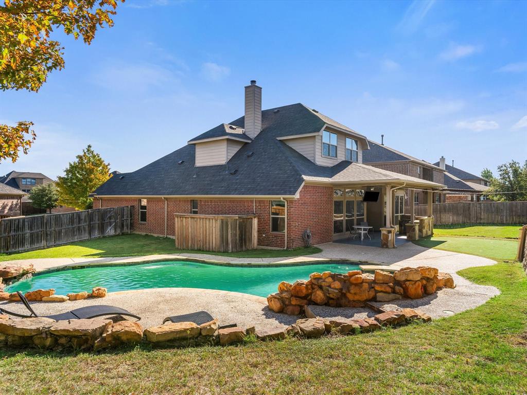437 Hackworth Street Roanoke, TX 76262 - Photo 4 of 35 a front view of house with yard and outdoor seating