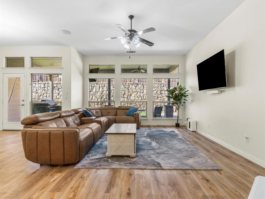437 Hackworth Street Roanoke, TX 76262 - Photo 9 of 35 a living room with furniture and a flat screen tv