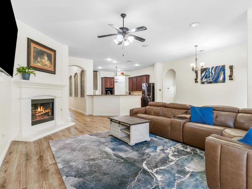 437 Hackworth Street Roanoke, TX 76262 - Photo 10 of 35 a living room with furniture and a fireplace
