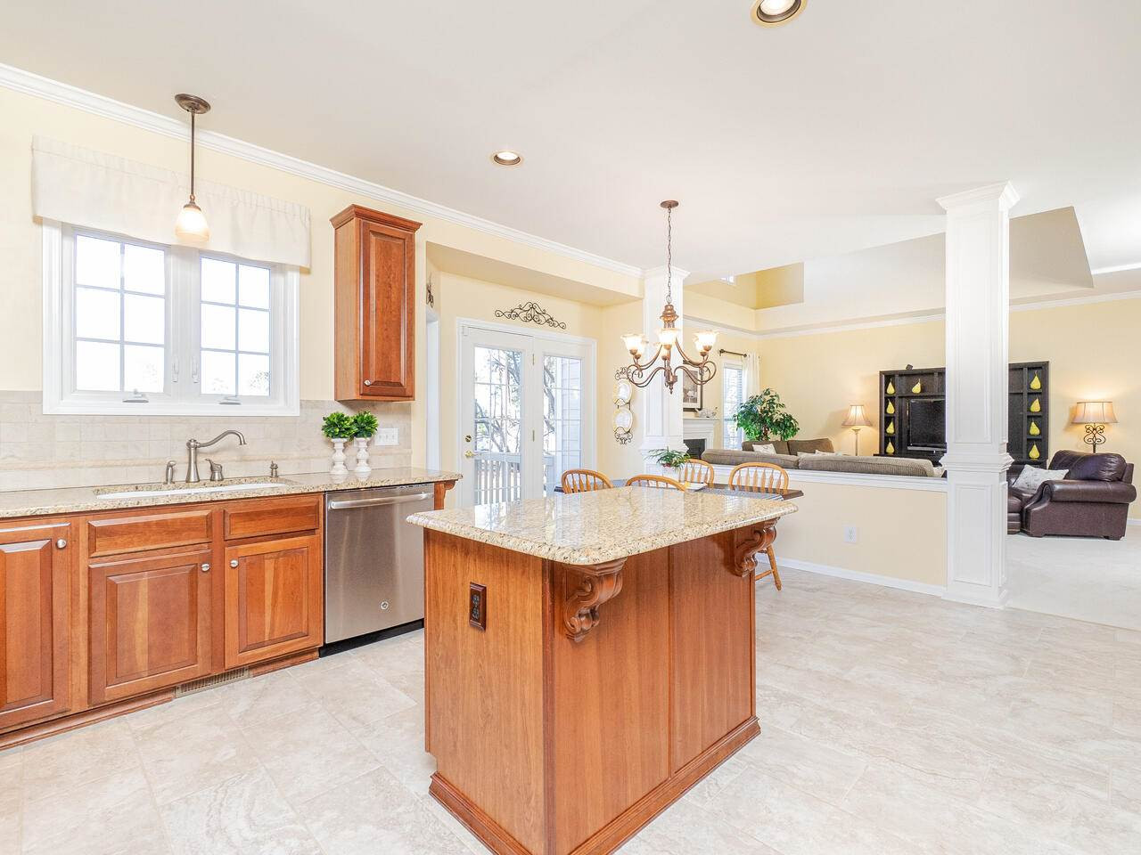426 Seastone Street Raleigh, NC 27603 - Photo 17 of 30 a kitchen with stainless steel appliances granite countertop a sink and a stove