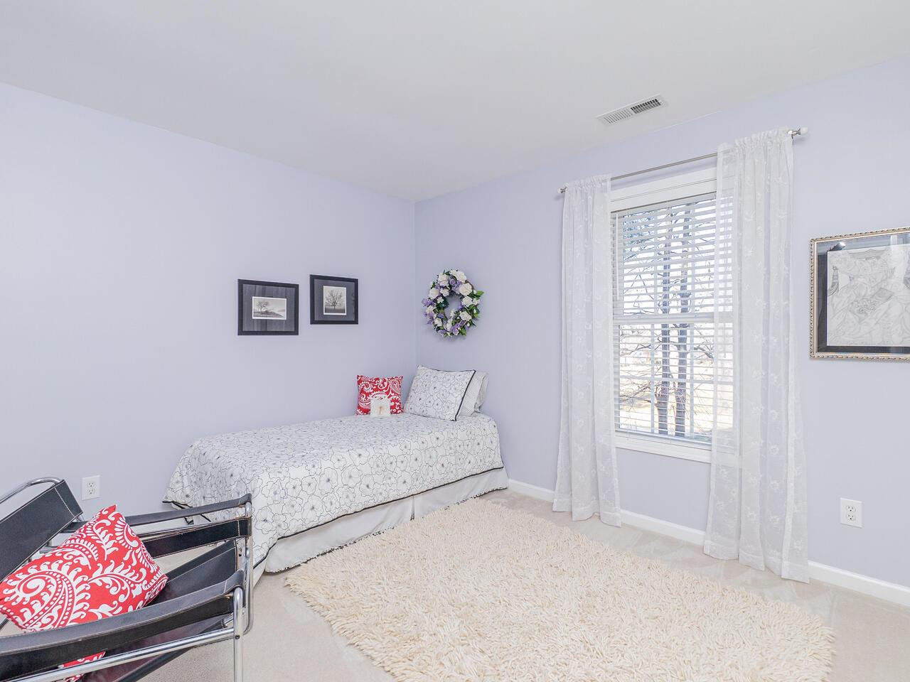 426 Seastone Street Raleigh, NC 27603 - Photo 19 of 30 a bedroom with a bed and a window