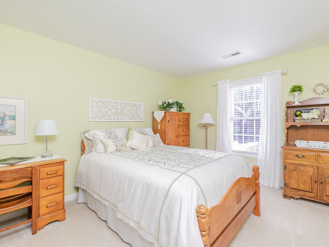 426 Seastone Street Raleigh, NC 27603 - Photo 20 of 30 a bedroom with a bed and a cabinets