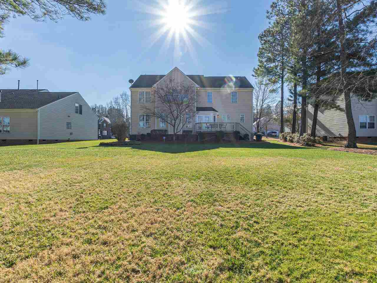 426 Seastone Street Raleigh, NC 27603 - Photo 28 of 30 a view of a swimming pool and a yard