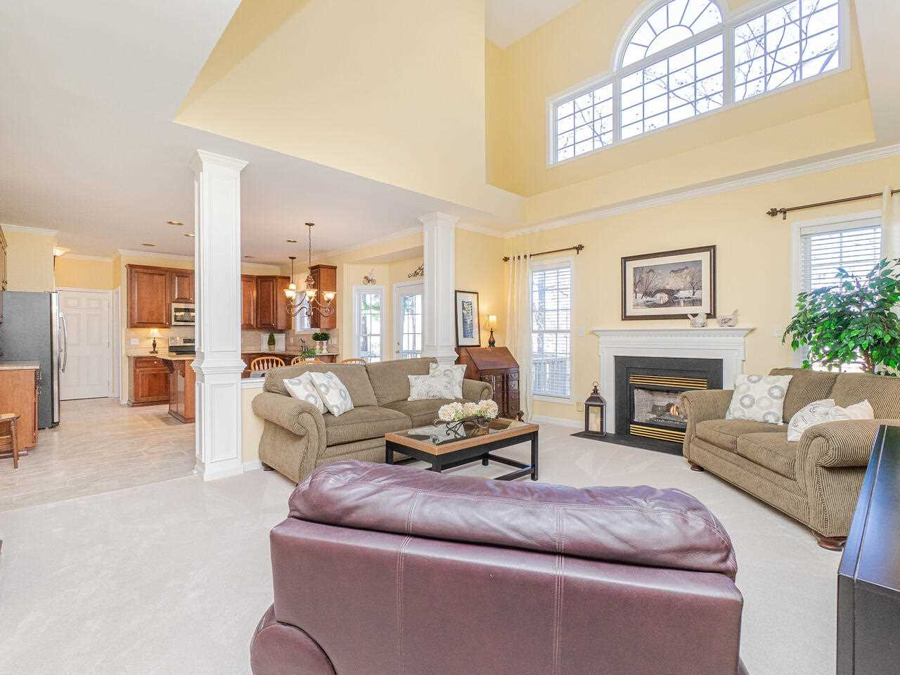 426 Seastone Street Raleigh, NC 27603 - Photo 8 of 30 a living room with furniture and a fireplace