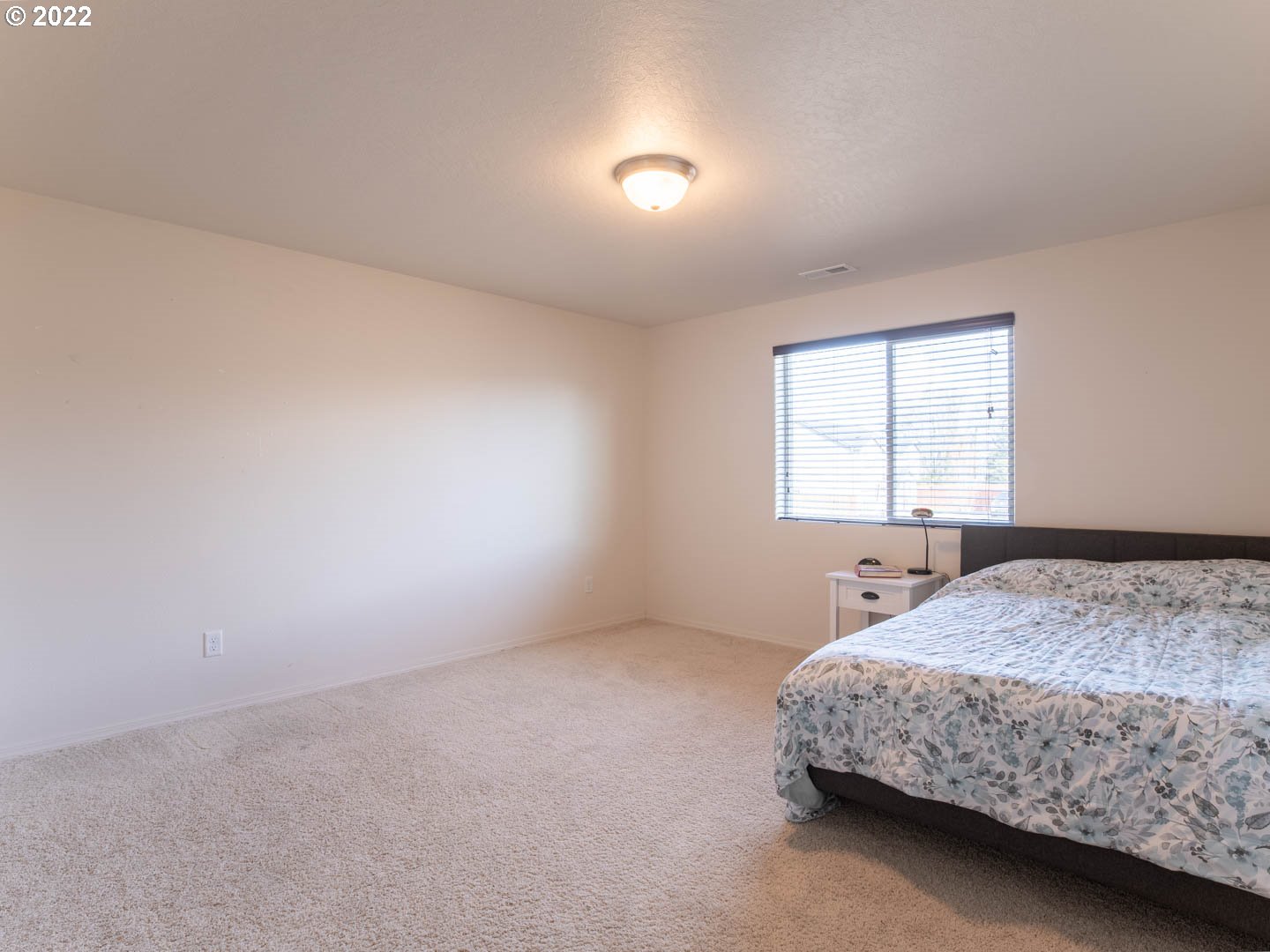 4664 Rocky Road Springfield, OR 97478 - Photo 15 of 21 a bedroom with a bed and a window