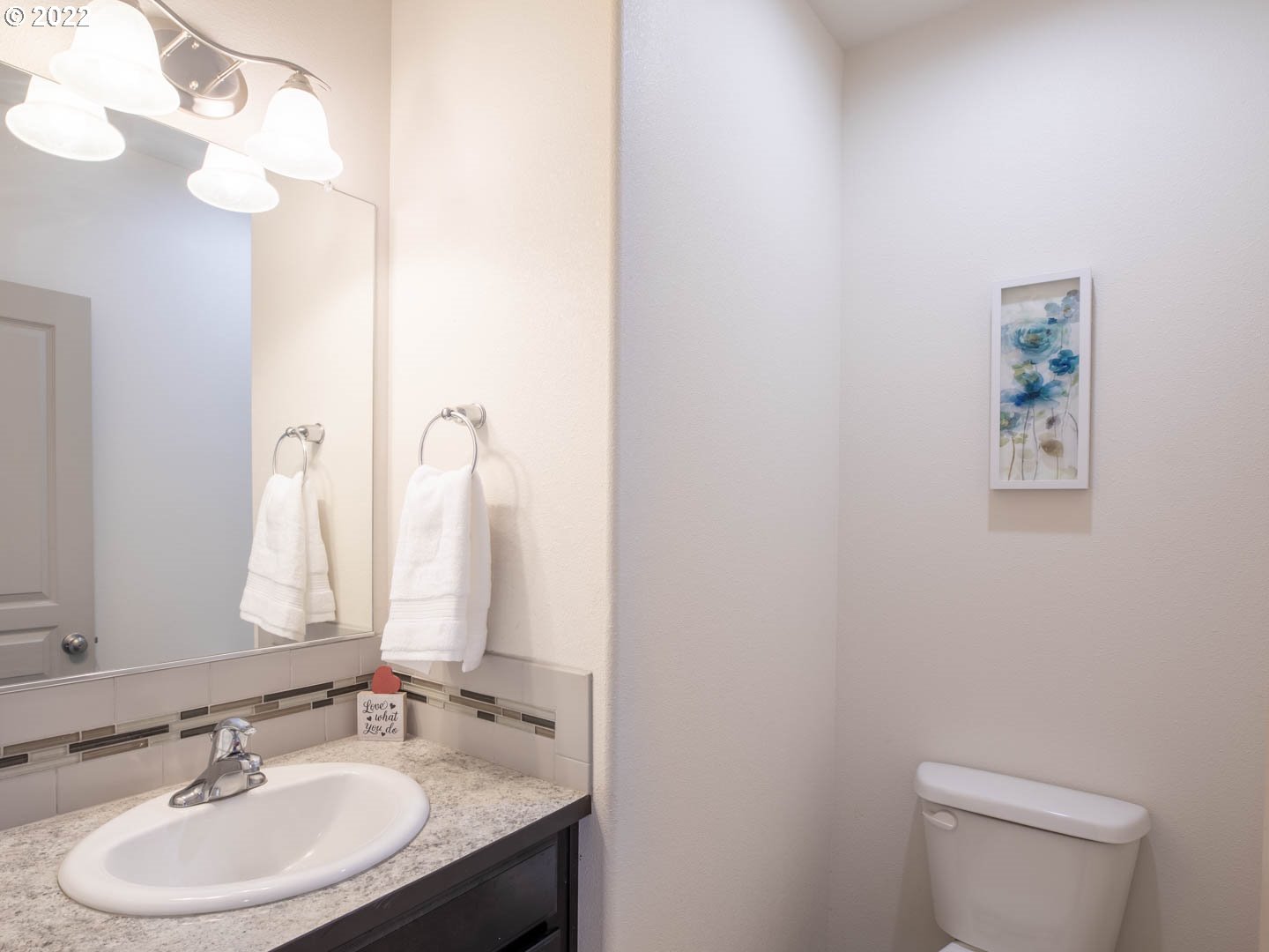 4664 Rocky Road Springfield, OR 97478 - Photo 8 of 21 a bathroom with a sink vanity mirror and toilet