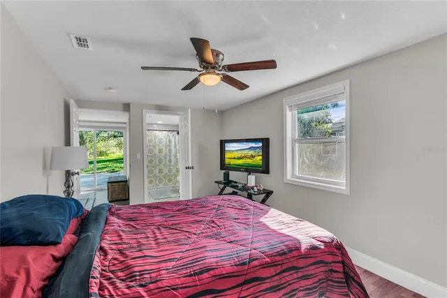 a room that has a bed and a chair in it