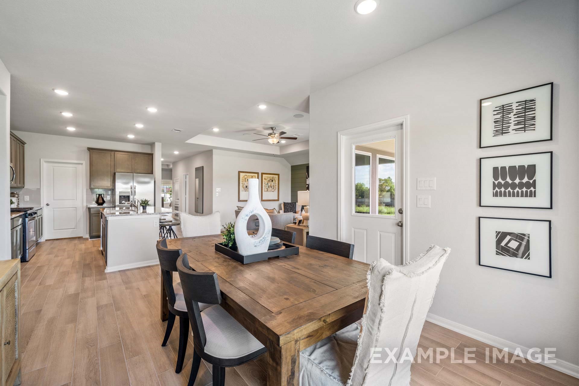 3311 Hidden Mist Drive Texas City, TX 77510 - Photo 15 of 37 a view of a dining room with furniture and wooden floor
