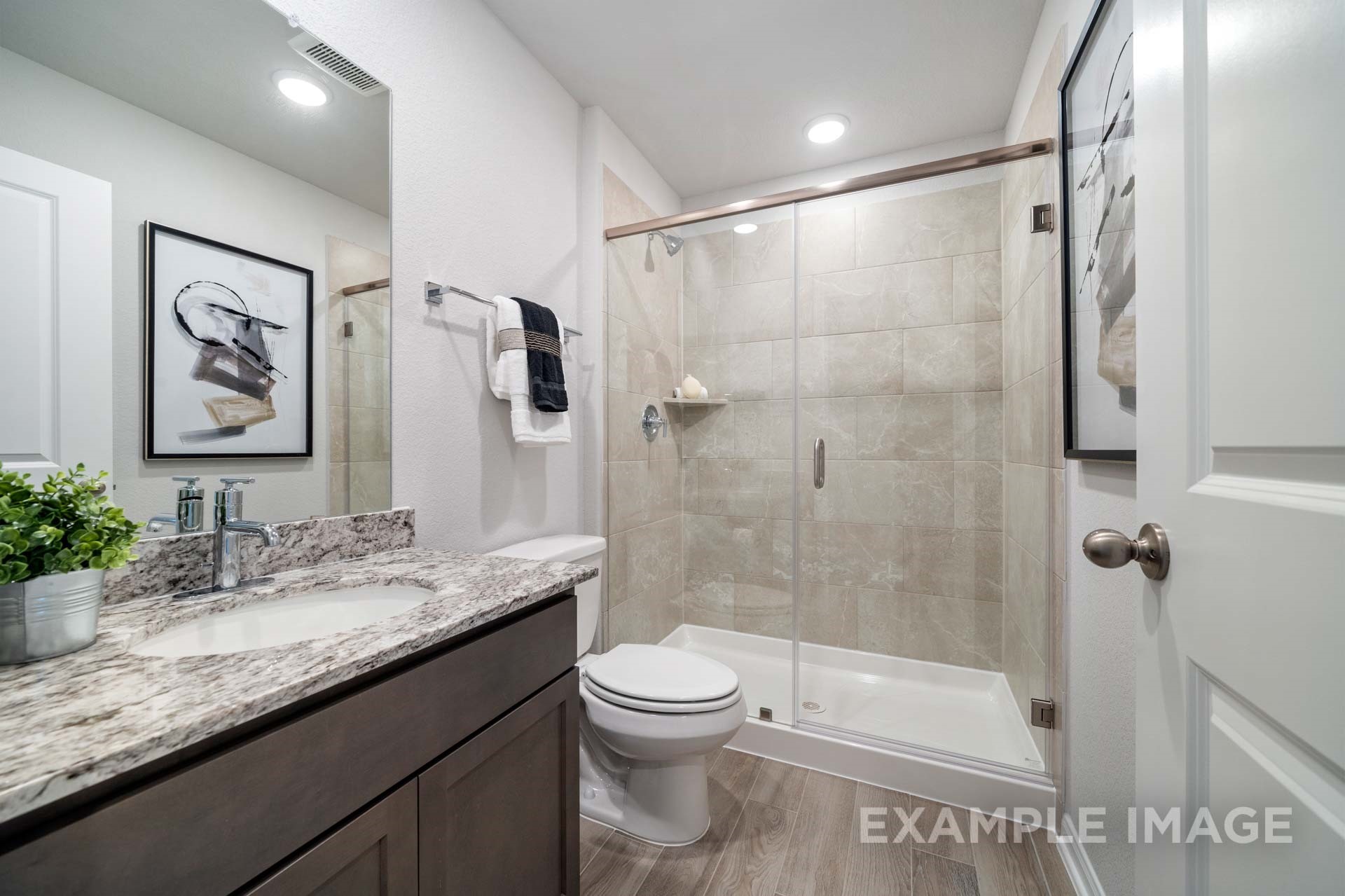 3311 Hidden Mist Drive Texas City, TX 77510 - Photo 31 of 37 a bathroom with a granite countertop sink toilet and shower
