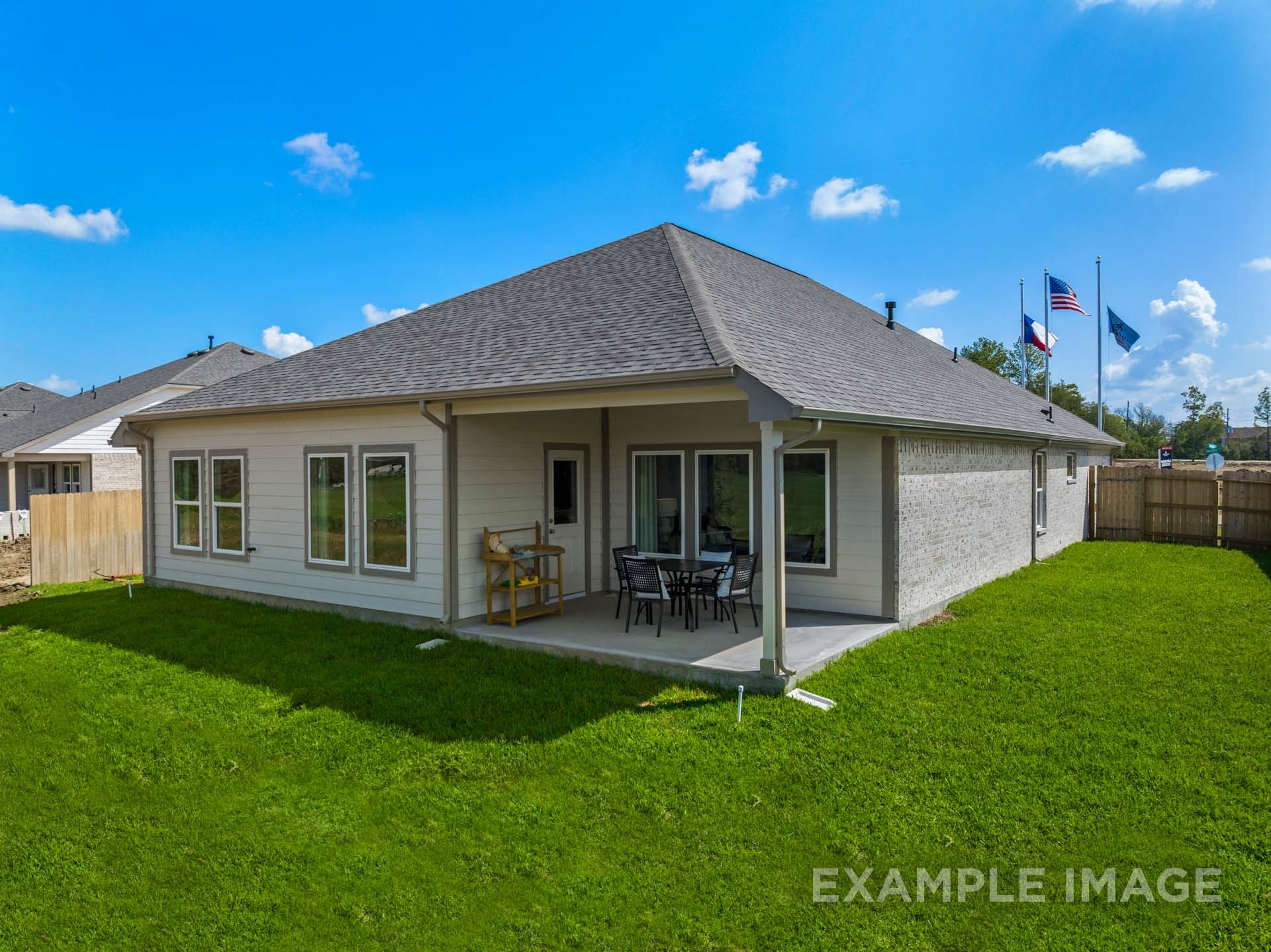 3311 Hidden Mist Drive Texas City, TX 77510 - Photo 37 of 37 a front view of a house with a garden and patio