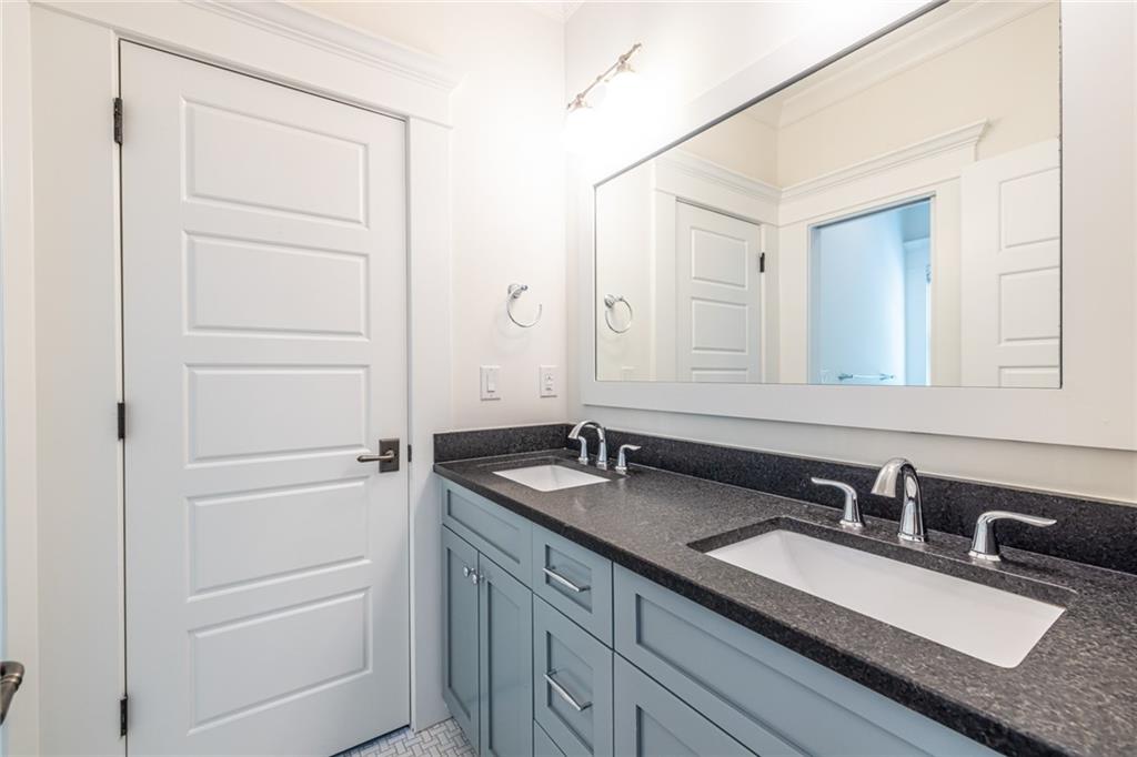 538 Ansley Street Decatur, GA 30030 - Photo 46 of 73 a bathroom with a granite countertop sink and a mirror