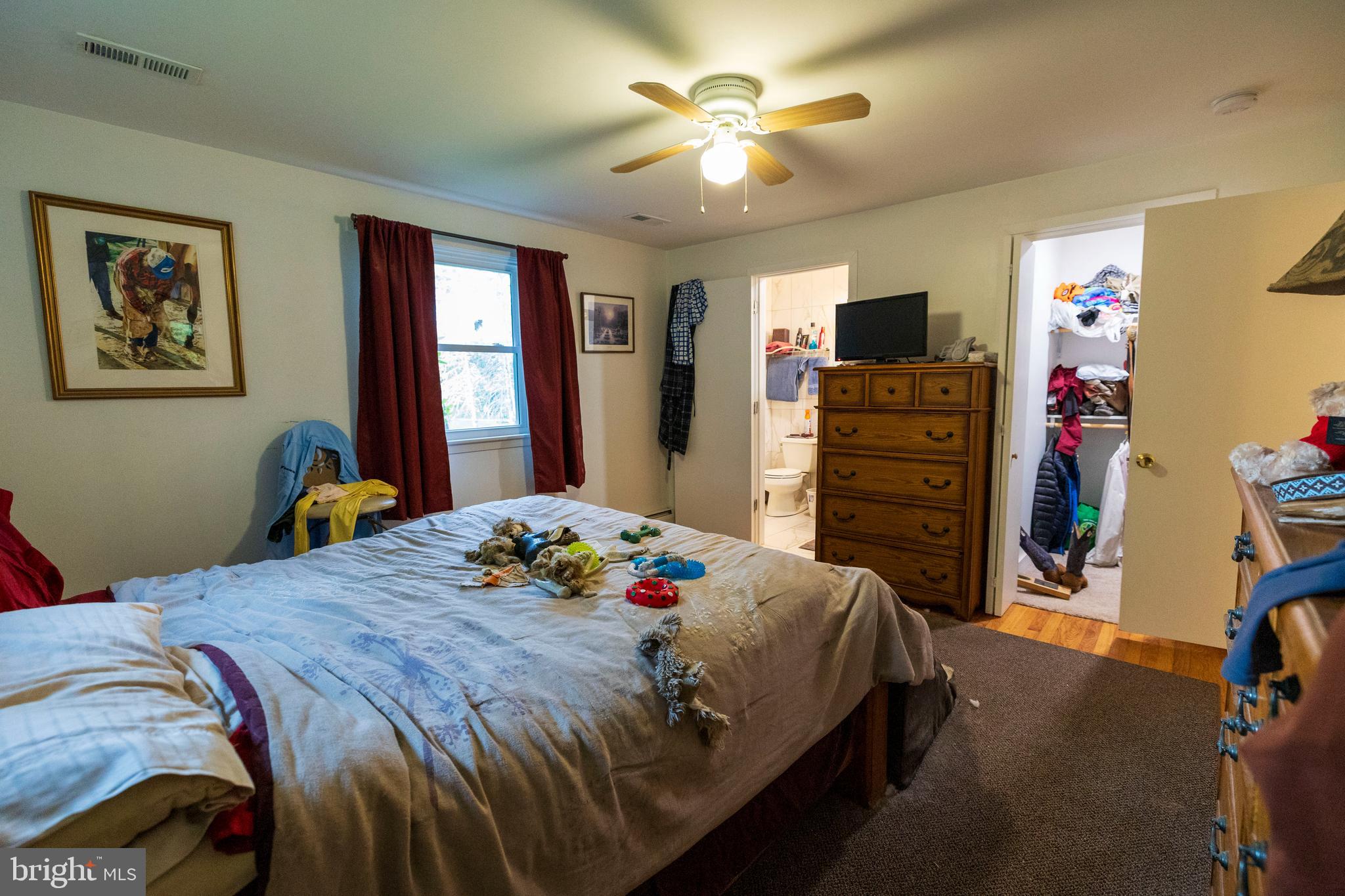 540 Doe Run Road Coatesville, PA 19320 - Photo 12 of 35 a bedroom with a bed and a chandelier