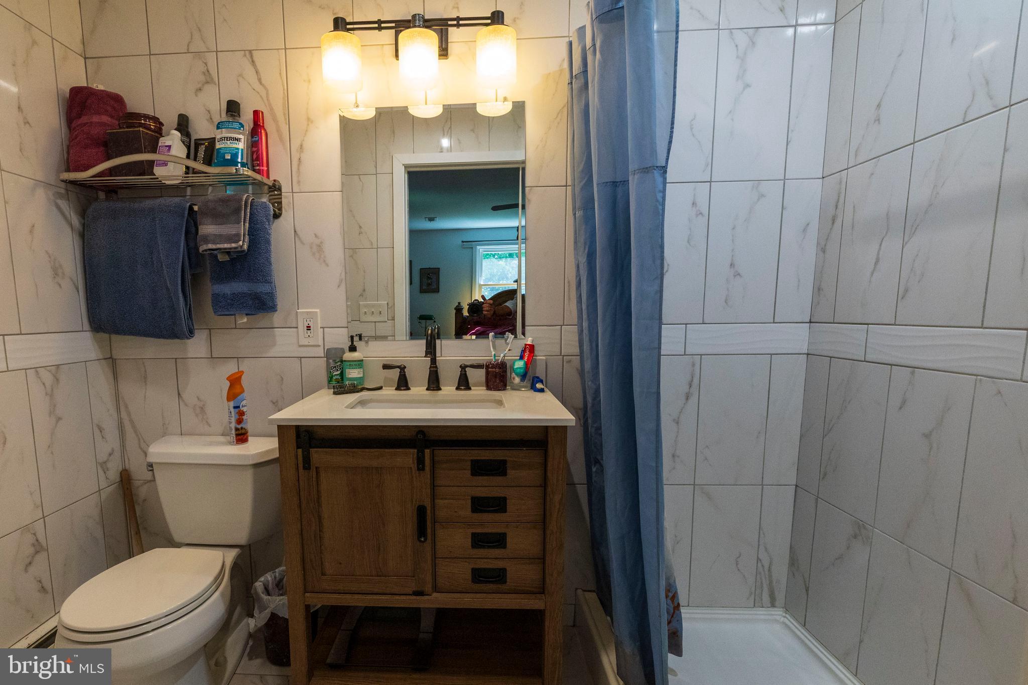 540 Doe Run Road Coatesville, PA 19320 - Photo 13 of 35 a bathroom with a sink a toilet and shower