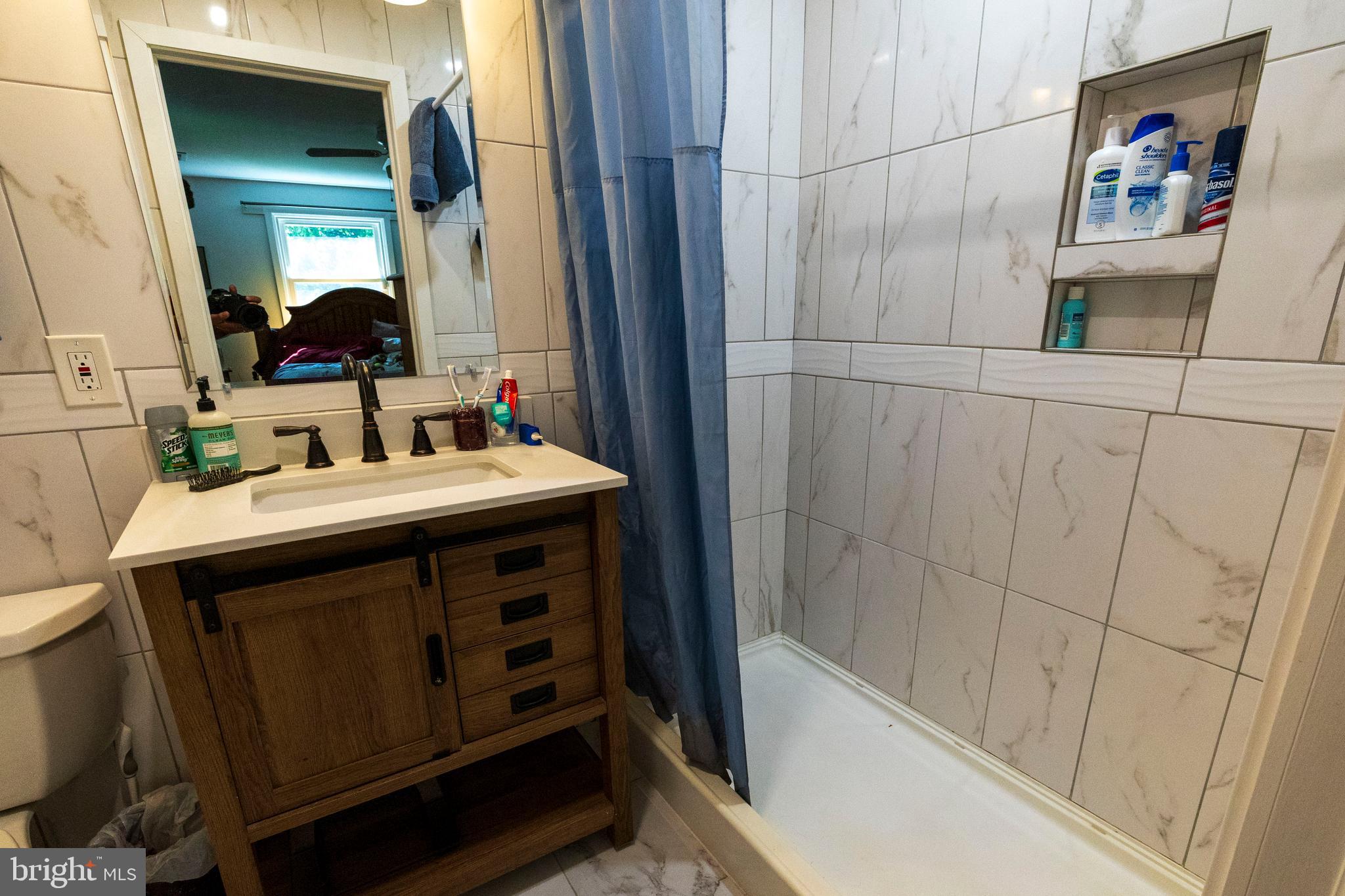 540 Doe Run Road Coatesville, PA 19320 - Photo 14 of 35 a bathroom with a sink and a mirror