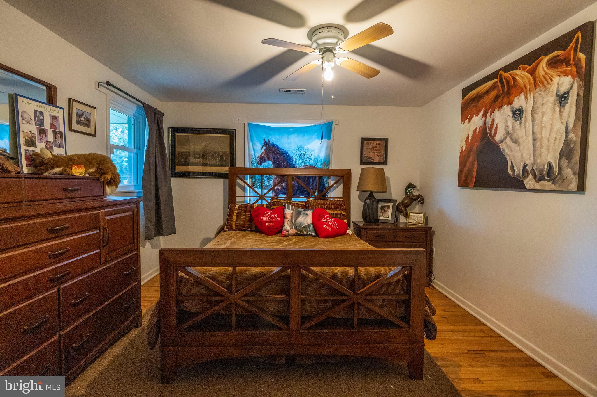 540 Doe Run Road Coatesville, PA 19320 - Photo 15 of 35 a bedroom with a bed and a chandelier