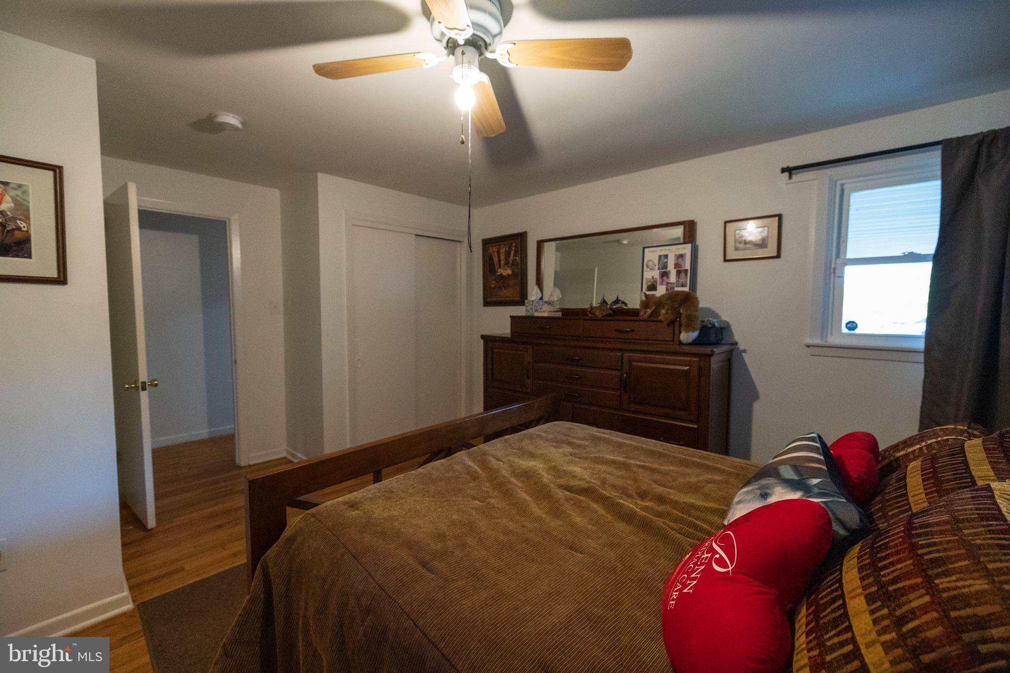 540 Doe Run Road Coatesville, PA 19320 - Photo 16 of 35 a bedroom with a bed and a chandelier