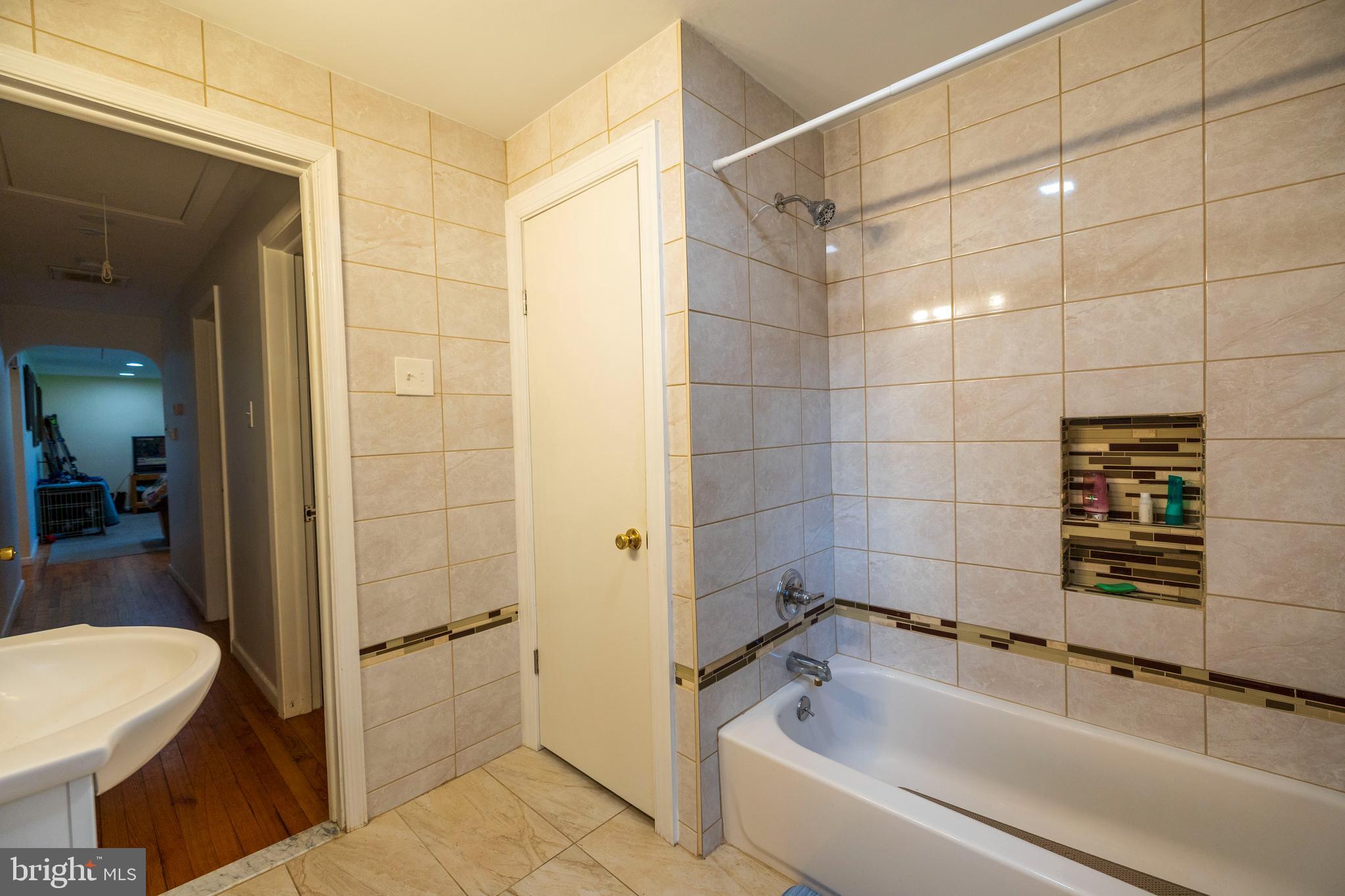 540 Doe Run Road Coatesville, PA 19320 - Photo 17 of 35 a bathroom with a bathtub and shower