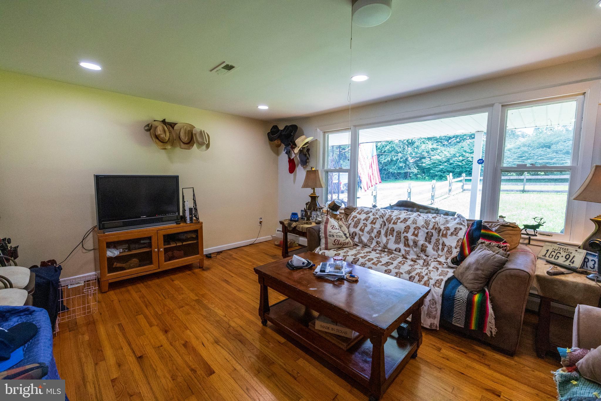 540 Doe Run Road Coatesville, PA 19320 - Photo 3 of 35 a living room with furniture and a flat screen tv