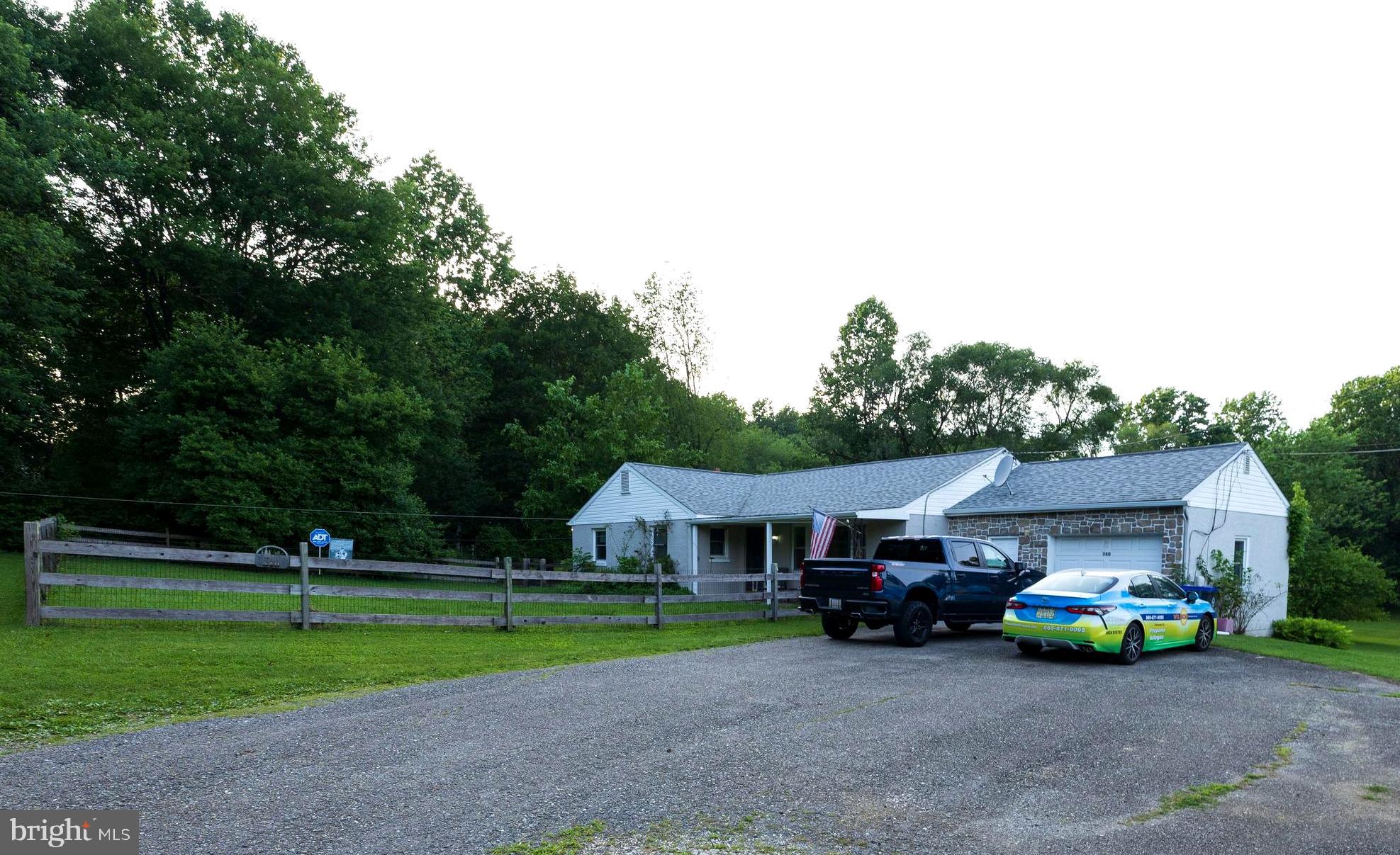540 Doe Run Road Coatesville, PA 19320 - Photo 32 of 35 a view of house with outdoor space and parking