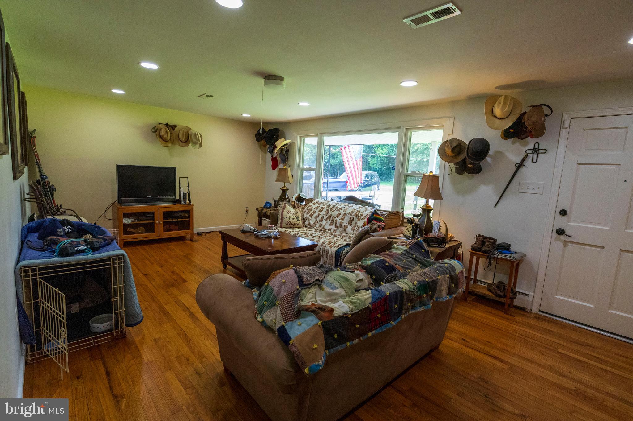 540 Doe Run Road Coatesville, PA 19320 - Photo 7 of 35 a living room with furniture and a flat screen tv