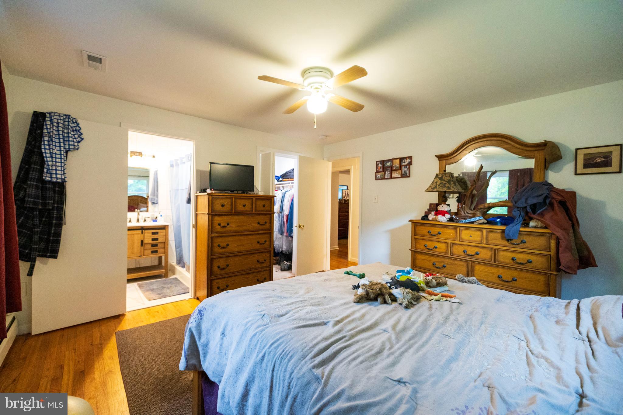 540 Doe Run Road Coatesville, PA 19320 - Photo 10 of 35 a bedroom with a bed and a flat tv screen