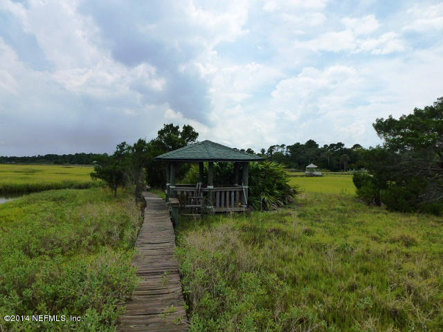 15775 Shellcracker Road Jacksonville, FL 32226 - Photo 18 of 25 a view of a lake with a garden
